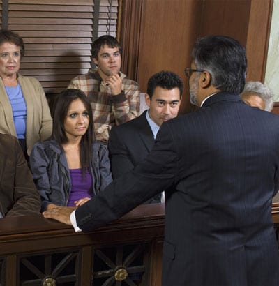 Attorney Speaking to a Jury in a Courtroom